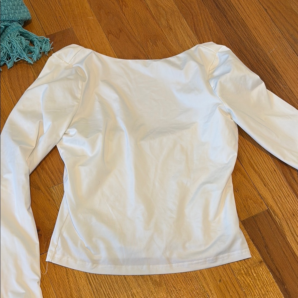 White long sleeve open back top
